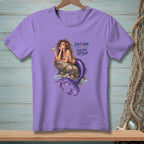 Purple t-shirt with illustration of a mermaid on a rock with text "Salty Hair. Saltier Attitude."
