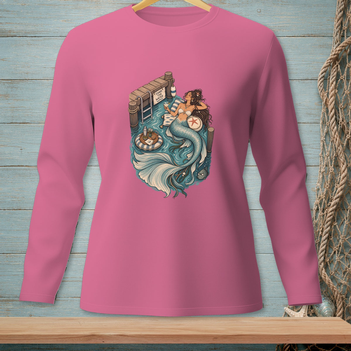 Mermaid relaxes on a dock with drinks and a sign that says "Share The Water".