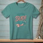 Teal t-shirt with "Resting Beach Face" design featuring a mermaid tail and sunglasses.