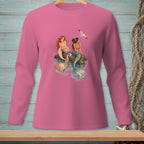 Pink long sleeve shirt with a print of two mermaids sitting on rocks with a seagull flying above.