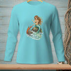 Long sleeve shirt with mermaid and lobster graphic on a rocky shore.