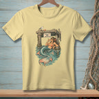 Light yellow t-shirt with graphic of mermaid drinking near "Absolutely No Drinking" sign.