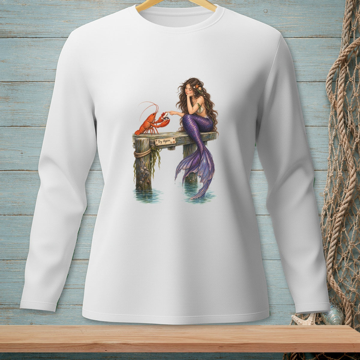 Mermaid sitting on dock next to lobster, with text "Try Again".