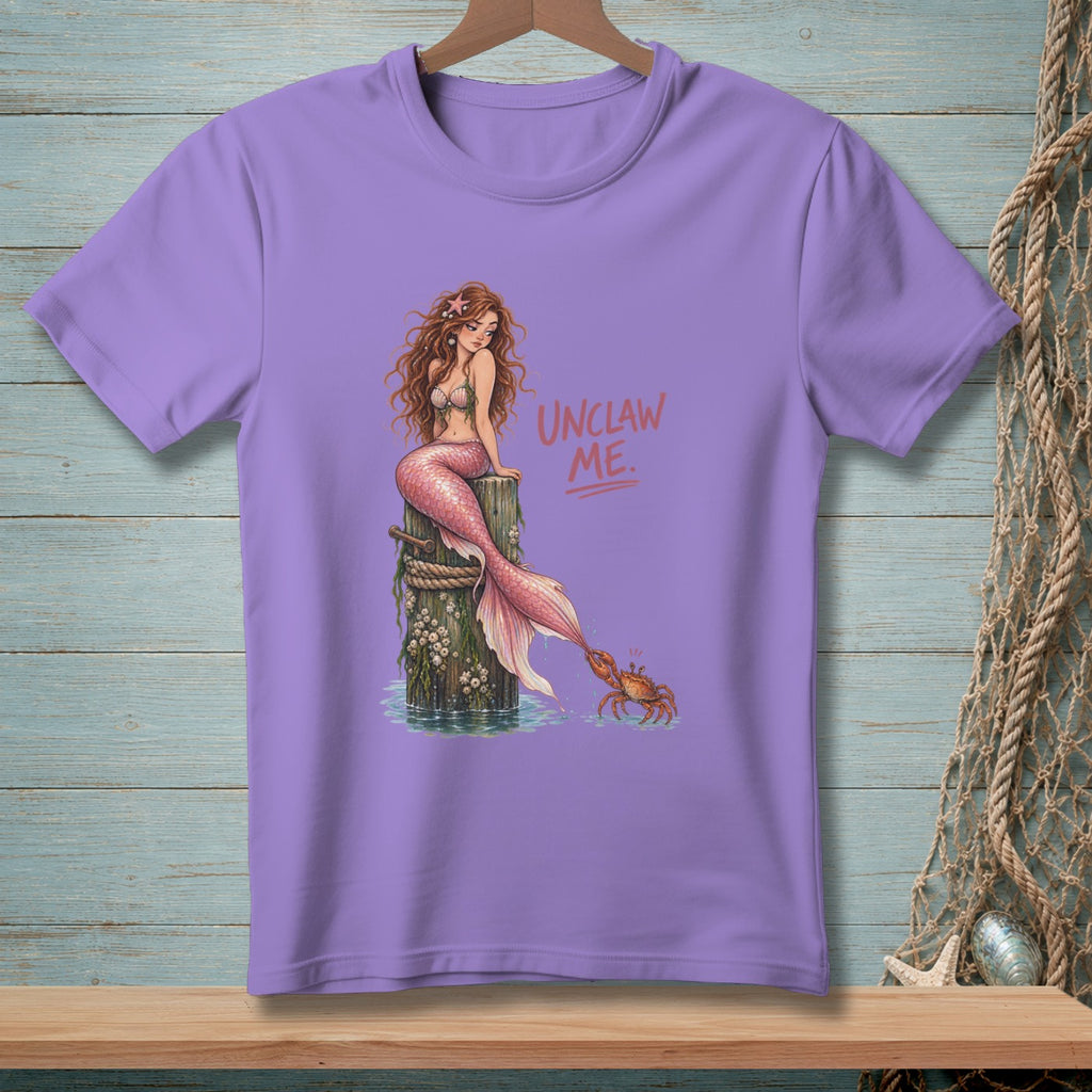 Lavender t-shirt with mermaid and crab art and "UNCLAW ME." text.