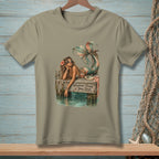 Mermaid lounging on a dock with text "Whatever Floats Your Boat".