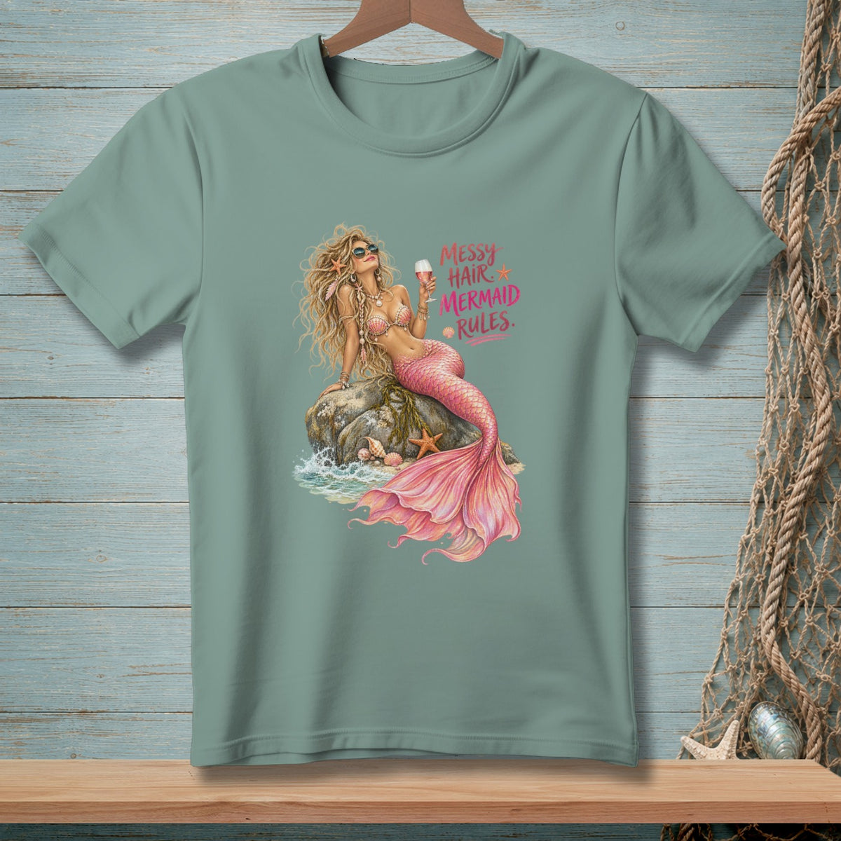Mermaid with pink tail on rock, holding drink, with "Messy Hair Mermaid Rules" text.
