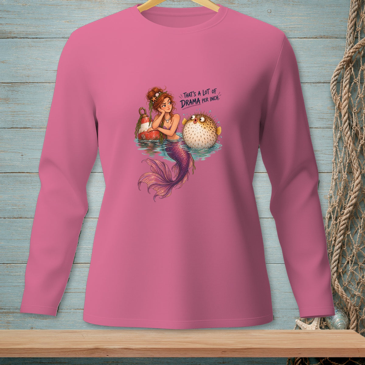 Mermaid with a pufferfish, text reads "That's a lot of drama per inch."