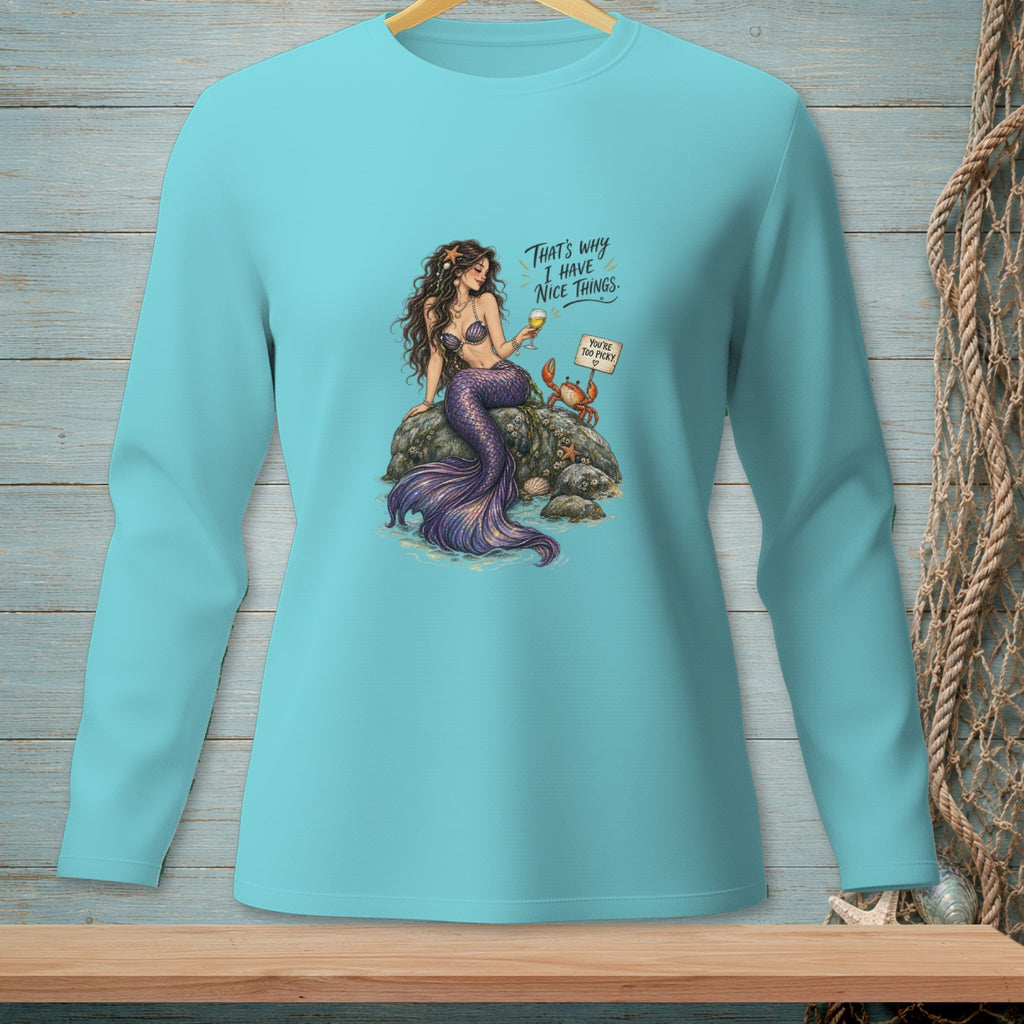 Turquoise long-sleeve shirt with mermaid, crab, and text.