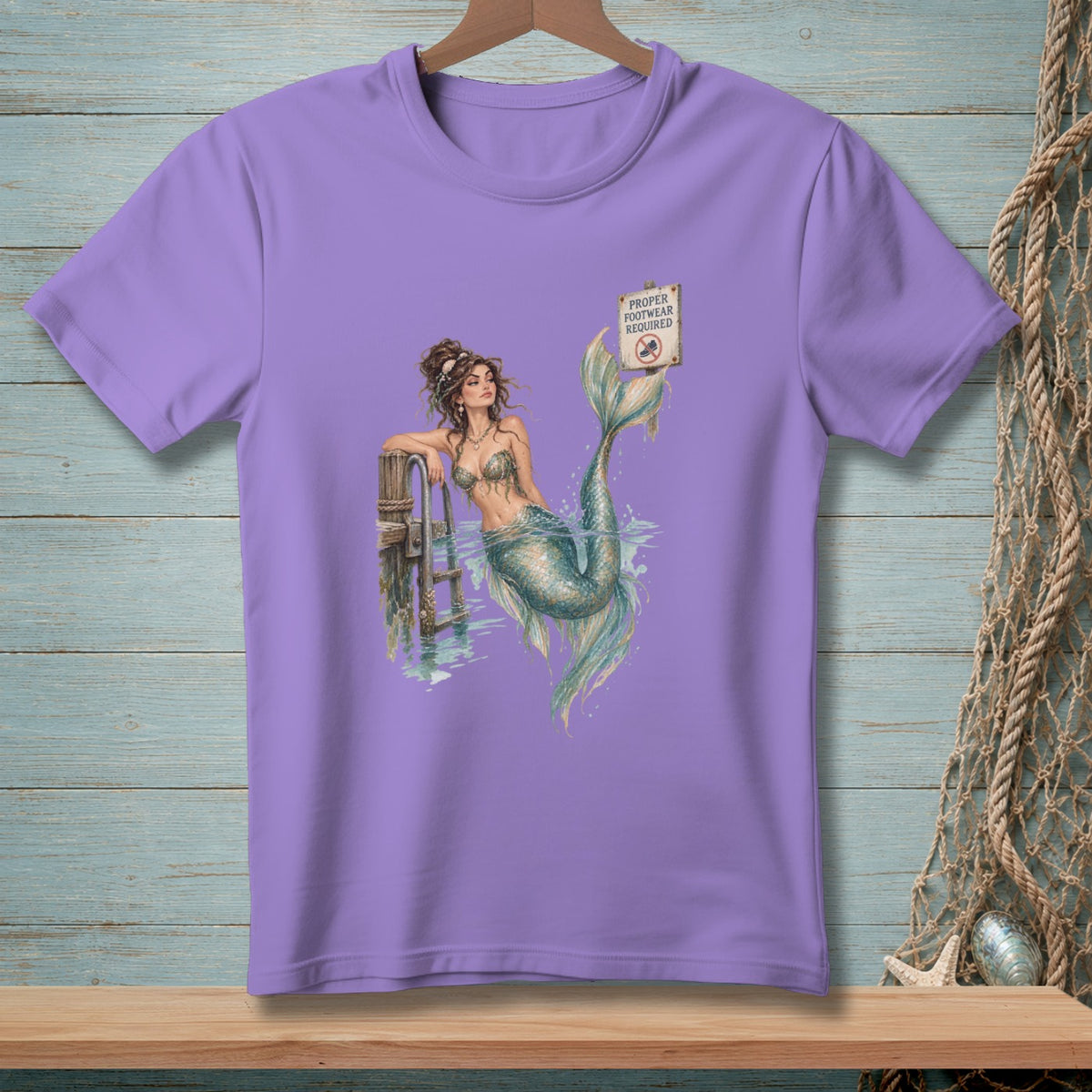 Mermaid leaning on a dock with "Proper Footwear Required" sign.