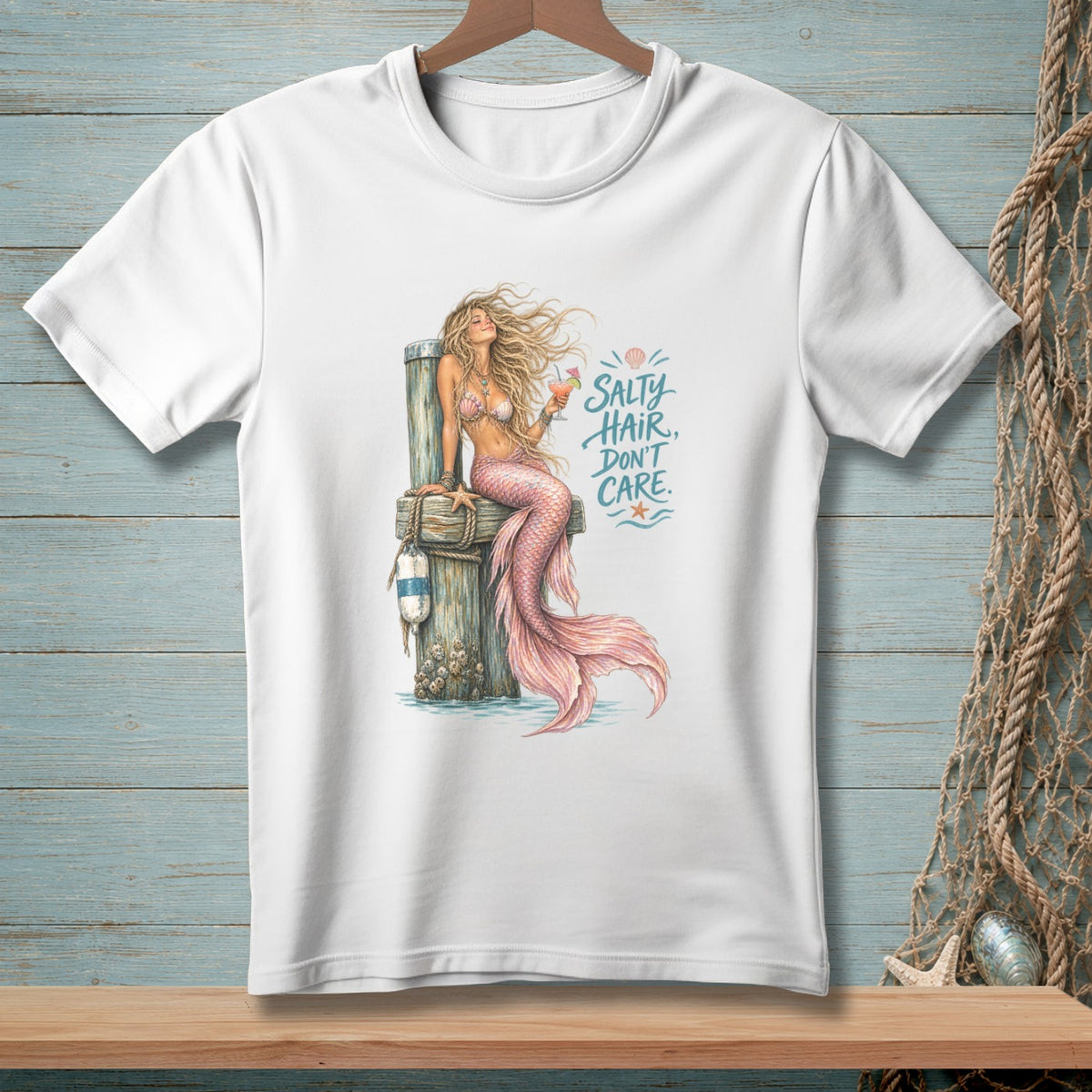 White t-shirt with "Salty Hair, Don't Care" text and mermaid illustration.