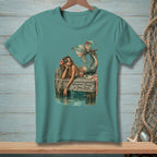 Mermaid on dock with sunglasses and drink, "Whatever Floats Your Boat" text.