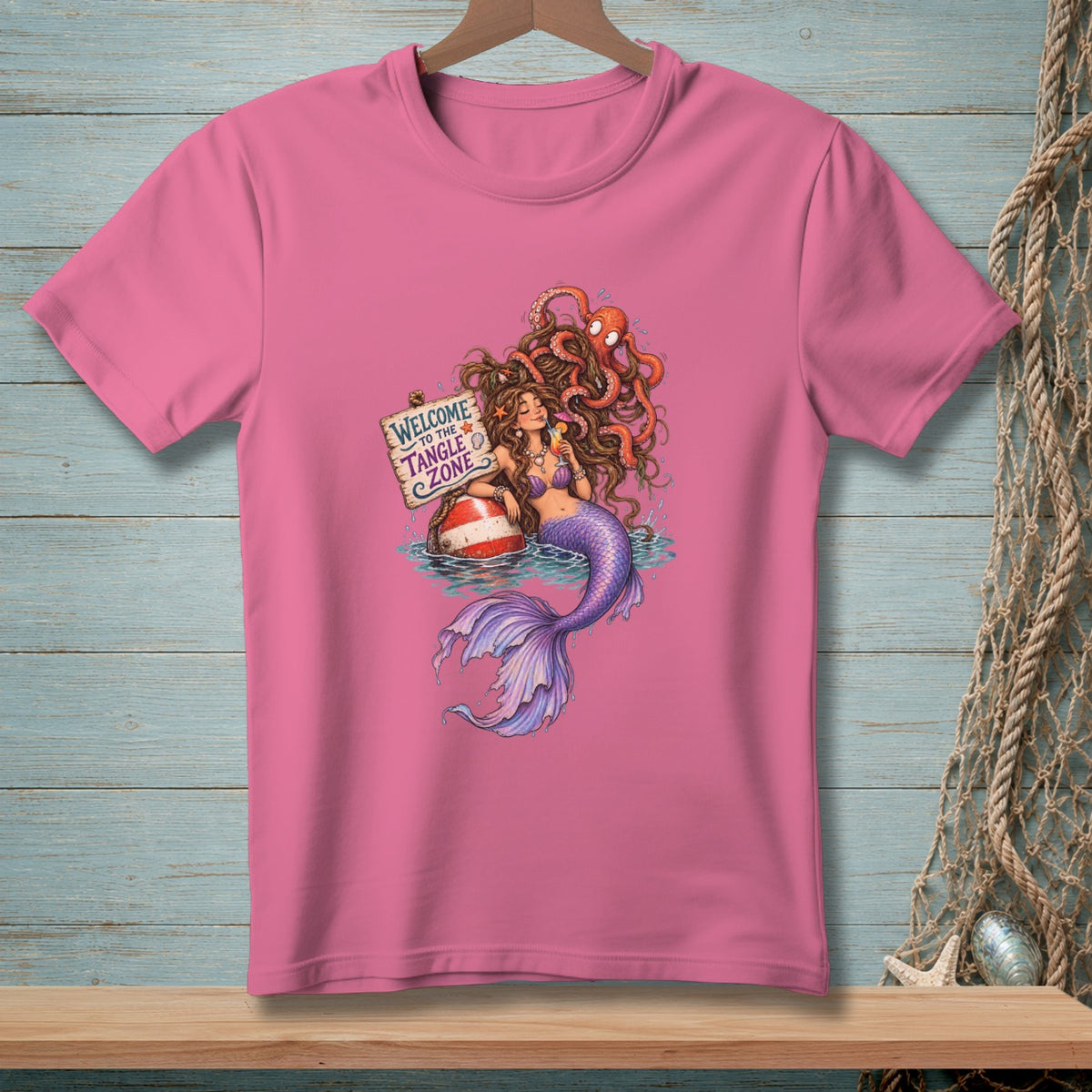 Pink t-shirt with a mermaid and octopus graphic, reading "Welcome to the Tangle Zone".