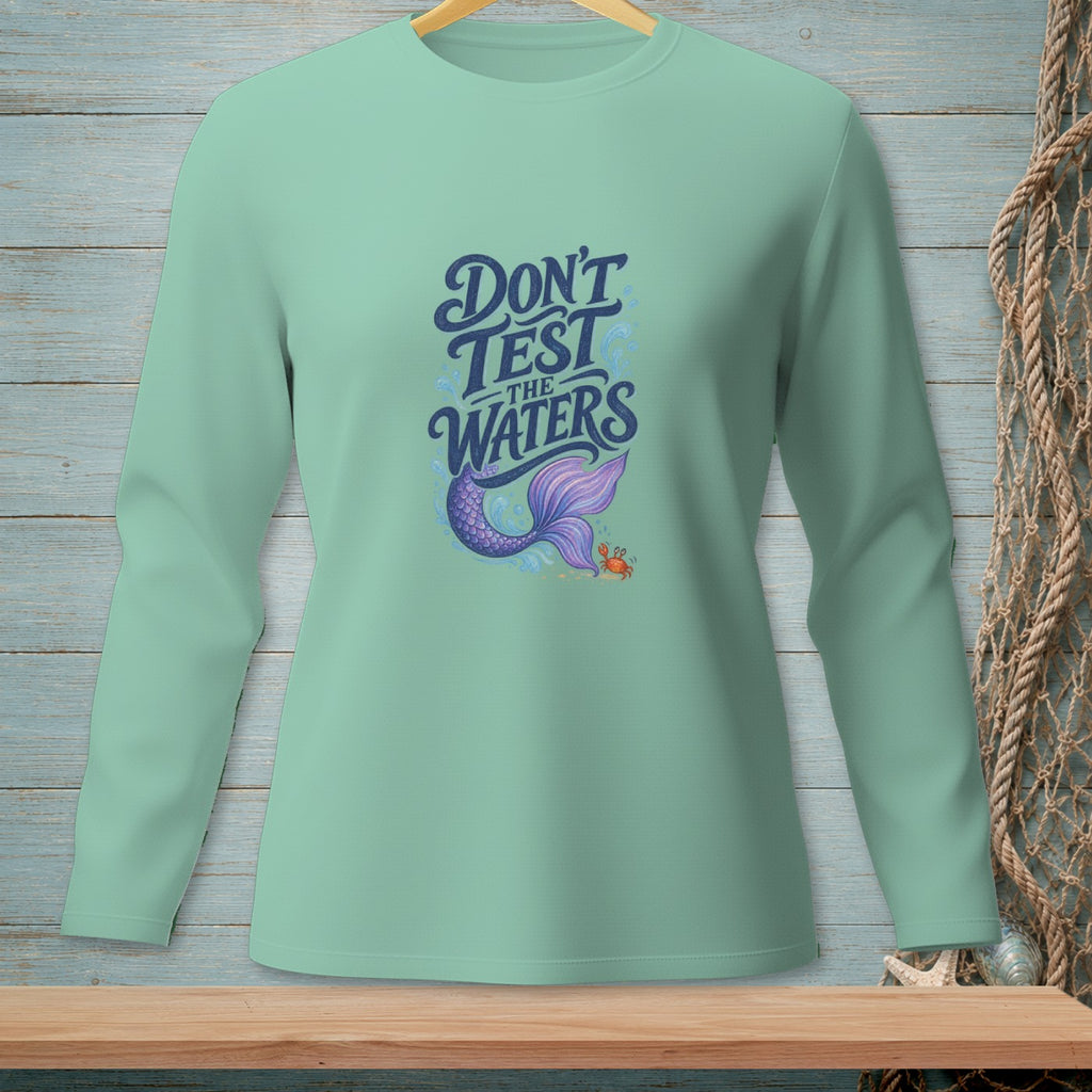 Light teal long-sleeved shirt with "Don't Test The Waters" and a mermaid tail.