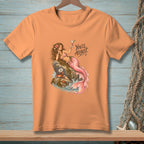 Peach t-shirt with a drawing of a mermaid holding a martini and the text "You'll ADJUST."
