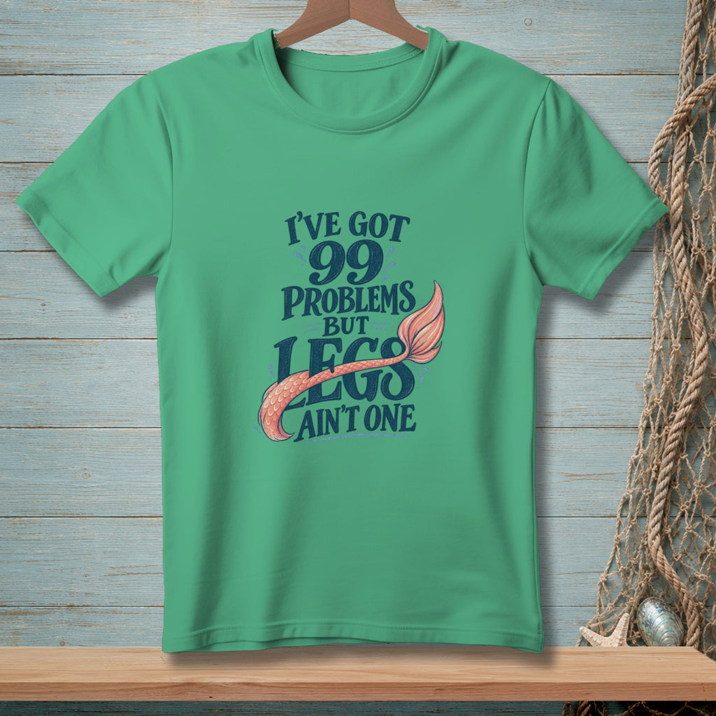 Green t-shirt with text "I've got 99 problems but legs ain't one" and mermaid tail.
