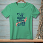 Green t-shirt with text "I've got 99 problems but legs ain't one" and mermaid tail.