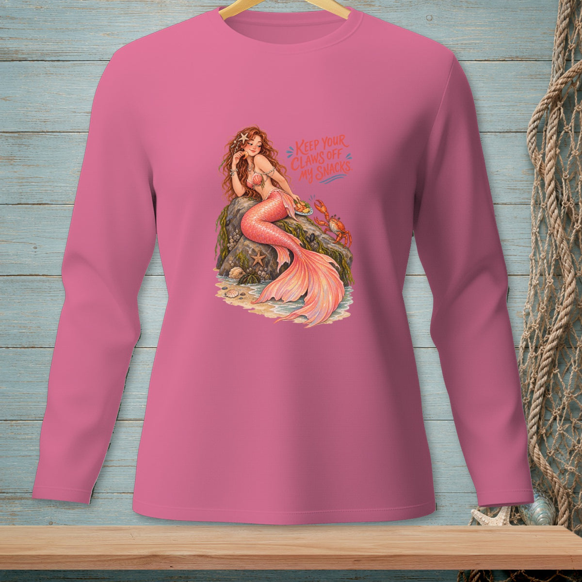 Pink long-sleeve shirt with mermaid illustration and text "Keep Your Claws Off My Snacks."