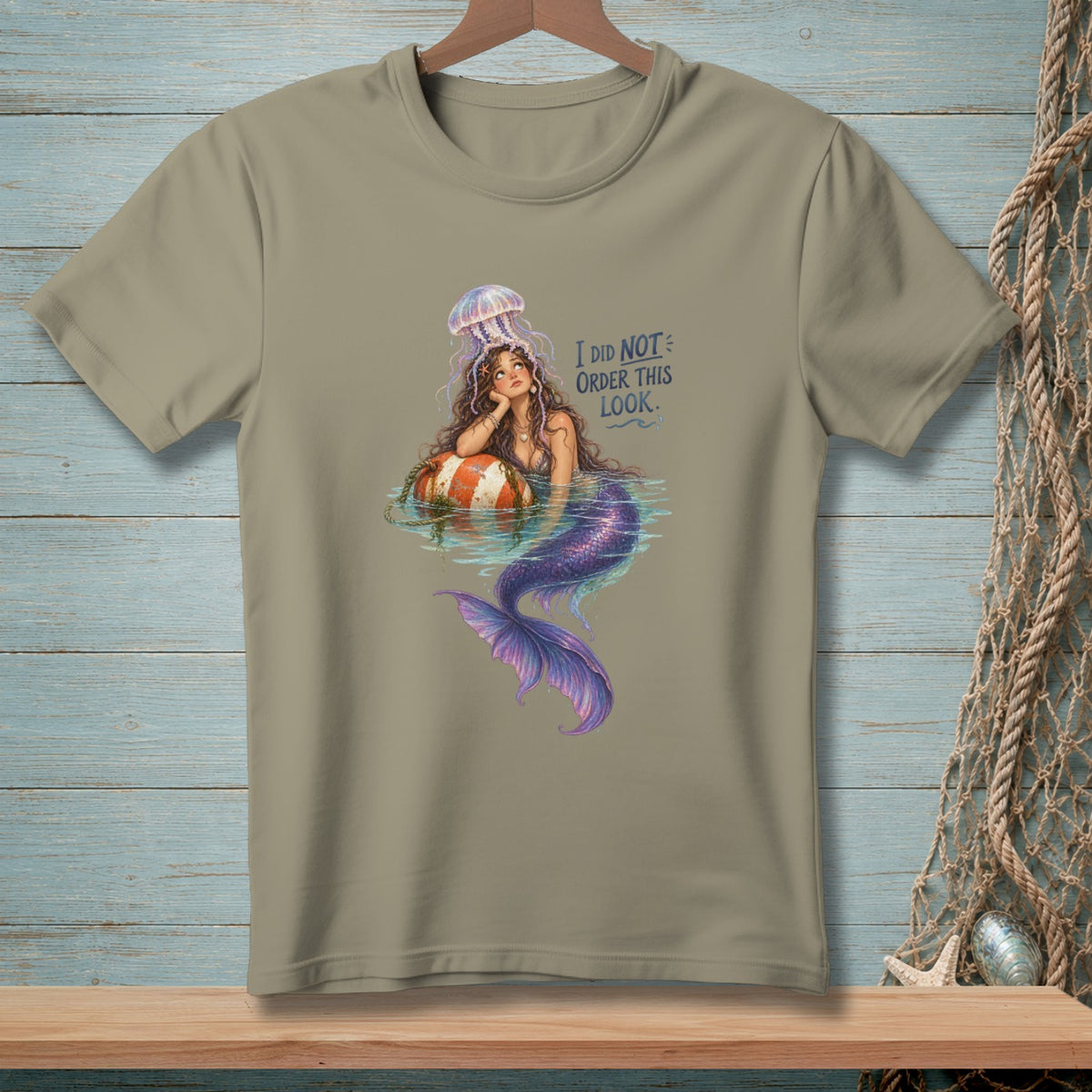 Mermaid with jellyfish on head sitting on a buoy, text "I DID NOT ORDER THIS LOOK".