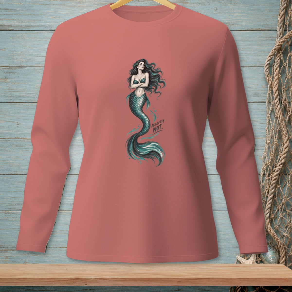 Long-sleeve salmon shirt with a mermaid graphic and text "ABSOLUTELY NOT."
