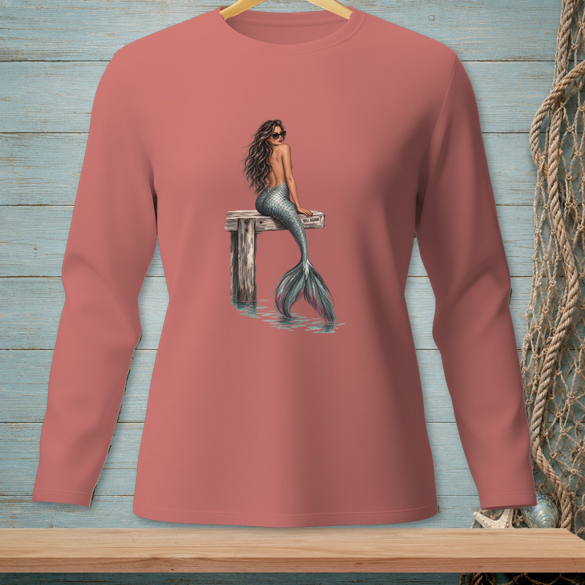 Mermaid with sunglasses sits on a dock, water below, "YOU AGAIN?" text.