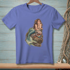 Mermaid with treasure chest on rock, featured on a purple t-shirt.