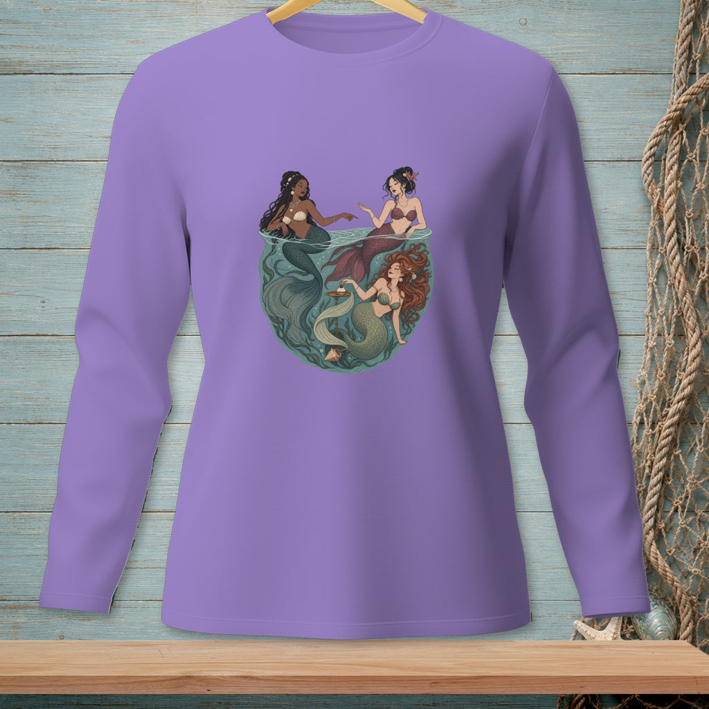 Three mermaids interact in a circular, underwater scene.
