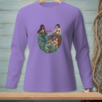 Three mermaids interact in a circular, underwater scene.