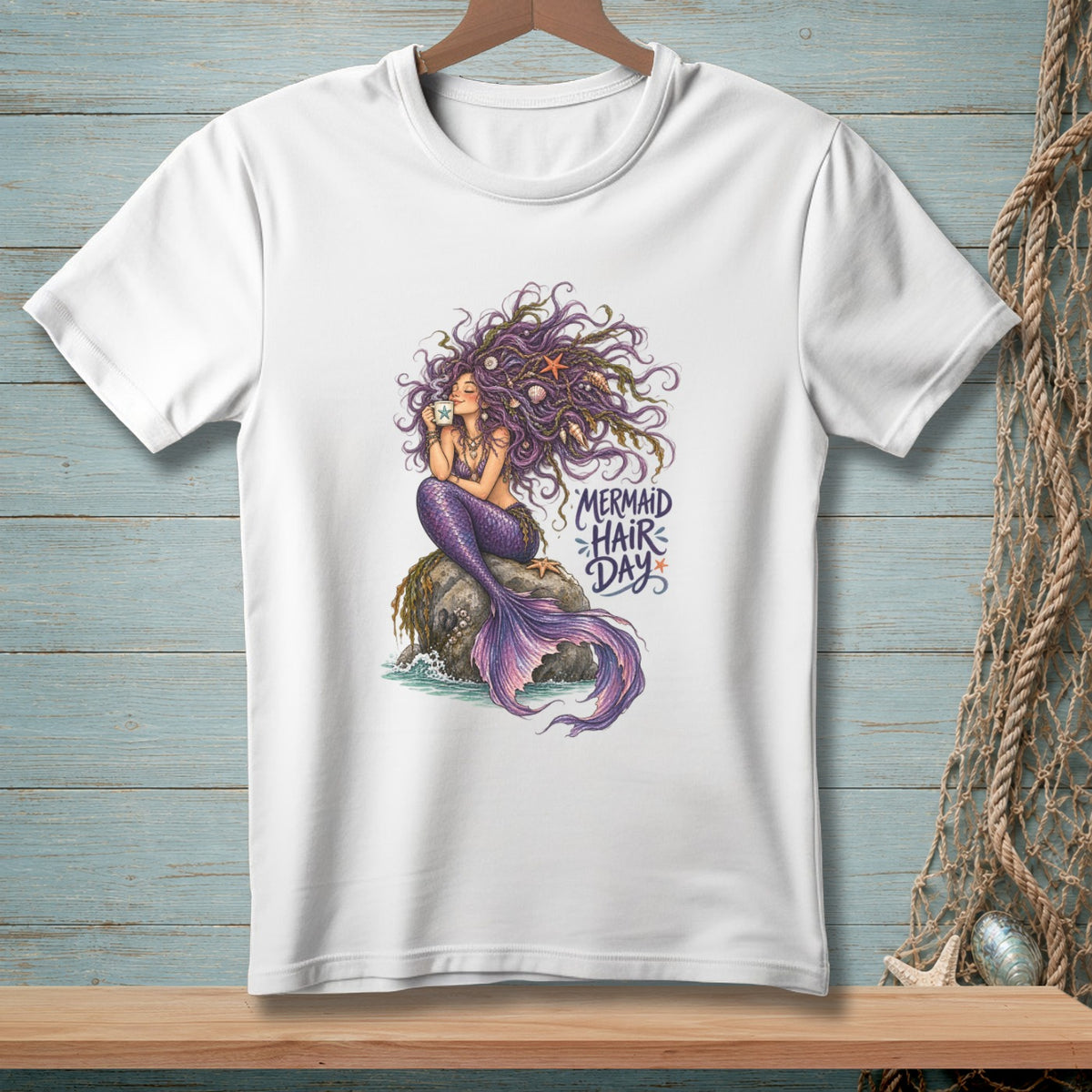 White t-shirt with mermaid illustration and text "Mermaid Hair Day".