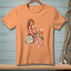 Peach t-shirt with mermaid, crab, and "Blame The Tail" sign.