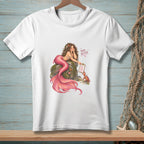 White t-shirt with a mermaid on a rock holding a checklist, with text "THERE. BETTER."