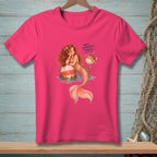 Pink t-shirt with mermaid leaning on a buoy and a pufferfish with text "Well, Somebody's Puffy".