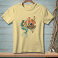 Light yellow t-shirt with mermaid and octopus serving drinks in a tropical setting.