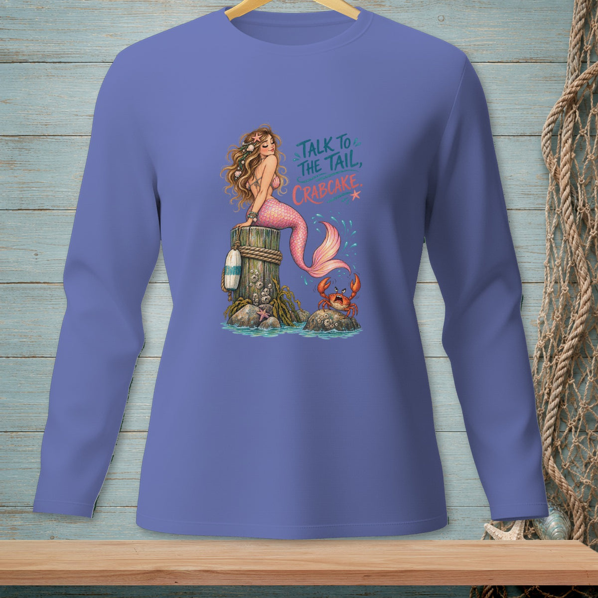 Mermaid on a post with crab below text "Talk to the tail, crabcake."
