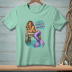 Mermaid relaxing on a dock drinking from a coconut with text "SALTY, TANGLED & UNBOTHERED."